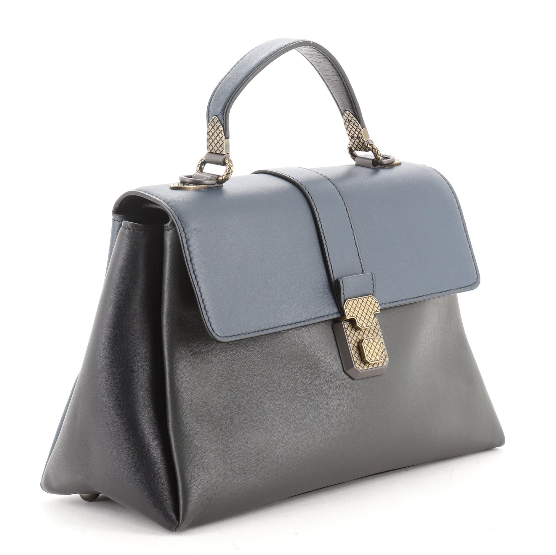 Bottega Veneta Piazza Top Handle Bag Leather with Intrecciato Detail Small
Blue, Gray

Condition Details: Wear on base corner, creasing and scuffs on exterior and underneath flap. loss of shape on handle, minor wear in interior, scratches on