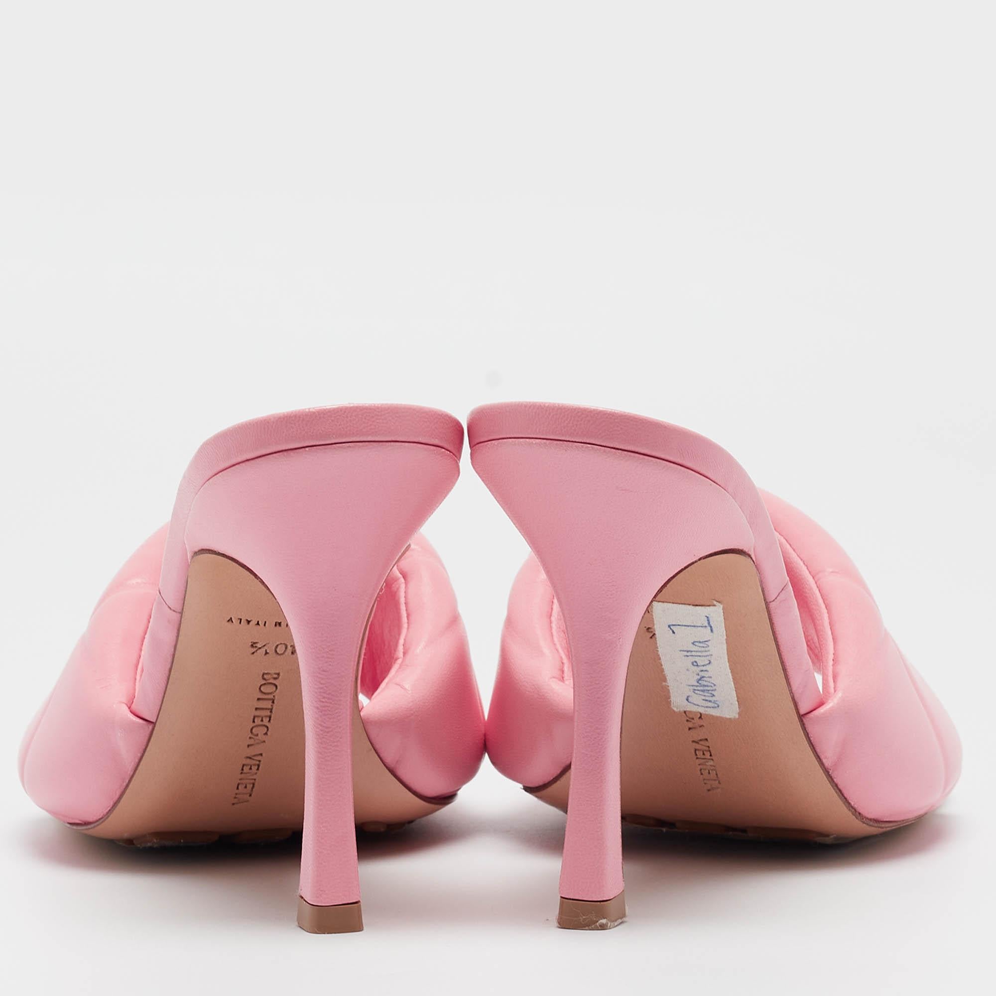 These slides are one of the most hot-selling designs from Bottega Veneta. These beauties have been crafted from pink leather. The upper strap is designed in a padded style with quilting and the sandals are set on 10cm heels.

Includes: Original