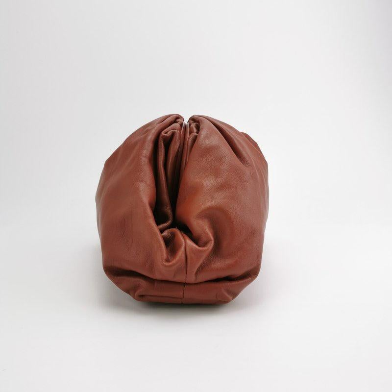 Bottega Veneta Pouch Calfskin Leather Brick Red Large
  These are professional photos of the actual bag offered by Luxbags.
  This Bottega Veneta Pouch stands out brilliantly, with its luxurious calfskin leather. On the inside, it features soft