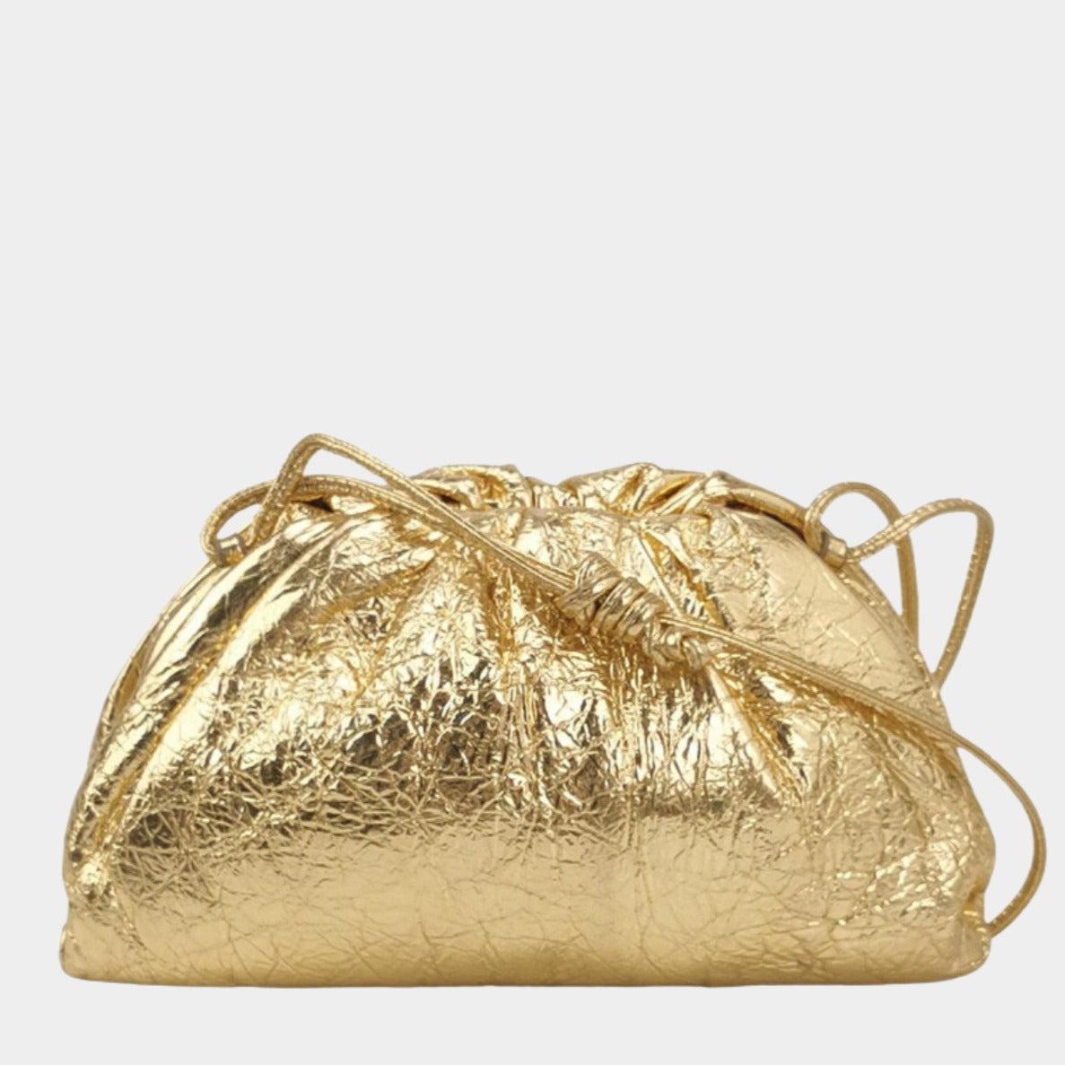 Bottega Veneta Pouch Mini Gold Lambskin Leather Crossbody Bag These are professional photos of the actual bag offered by Luxbags. Discover the sophisticated luxury of the Bottega Veneta Pouch Mini. Revel in its stylish cult design, handcrafted in a