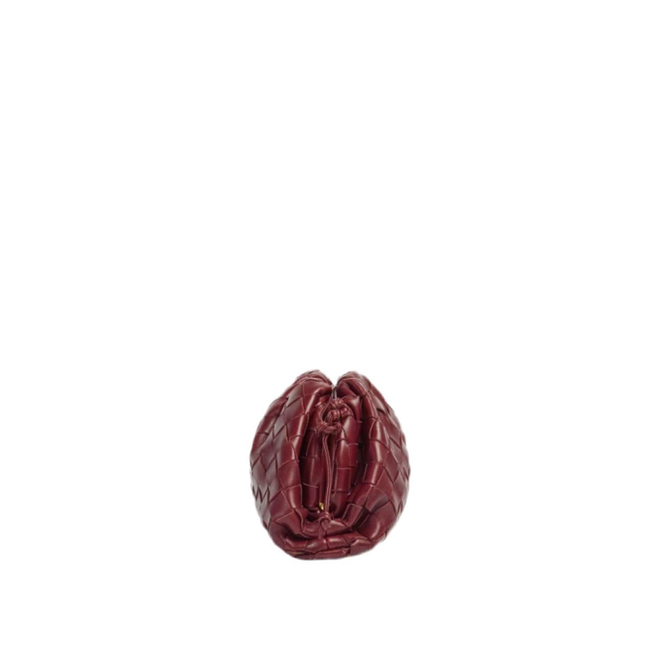 Bottega Veneta Pouch Mini Intrecciato Burgundy Leather Crossbody Bag
 These are professional photos of the actual bag offered by Luxbags.
 Discover the sophisticated luxury of the Bottega Veneta Pouch Mini. Revel in its stylish cult design,