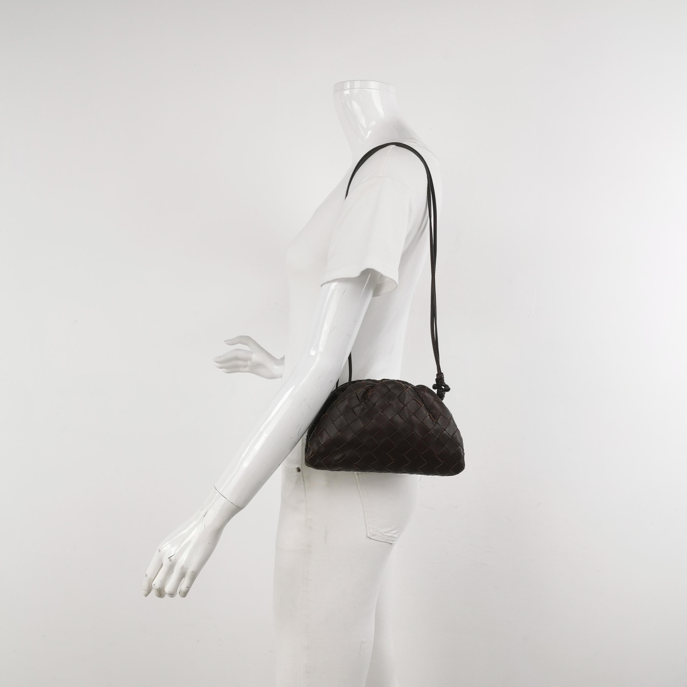 Bottega Veneta Pouch Mini Intrecciato Dark Chocolate Brown Lambskin Leather Crossbody Bag
These are professional photos of the actual bag.
  Discover the sophisticated luxury of the Bottega Veneta Pouch Mini. Revel in its stylish cult design,