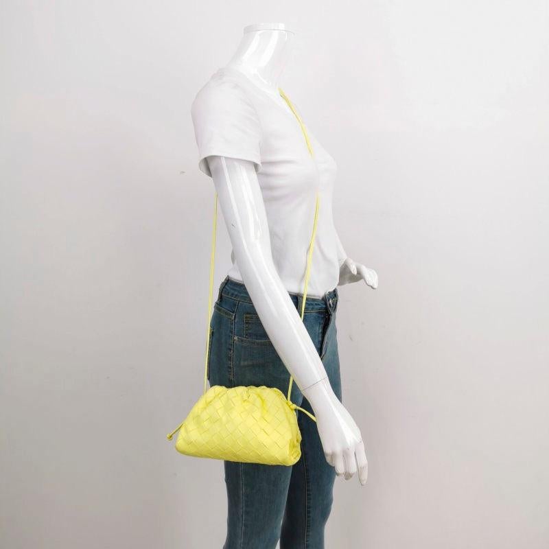 Bottega Veneta Pouch Mini Leather Lemon Yellow
  These are professional photos of the actual bag.
  Discover the sophisticated luxury of the Bottega Veneta Pouch Mini. Revel in its stylish cult design, handcrafted in a luxurious nappa leather with a
