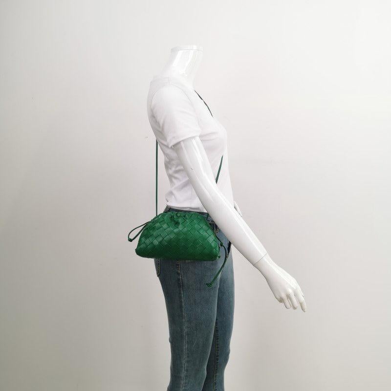 Bottega Veneta Pouch Mini Leather Parakeet Green
  These are professional photos of the actual bag.
  Discover the sophisticated luxury of the Bottega Veneta Pouch Mini. Revel in its stylish cult design, handcrafted in a luxurious nappa leather with