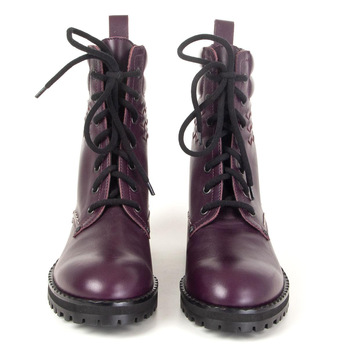 100% authentic Bottega Veneta lace-up Eldfell combat boots in grape tuscany calfskin with Intrecciato detail. Brand new. Come with dust bags. 

Measurements
Imprinted Size	38.5
Shoe Size	38.5
Inside Sole	25.5cm (9.9in)
Width	7.5cm (2.9in)
Heel	4cm