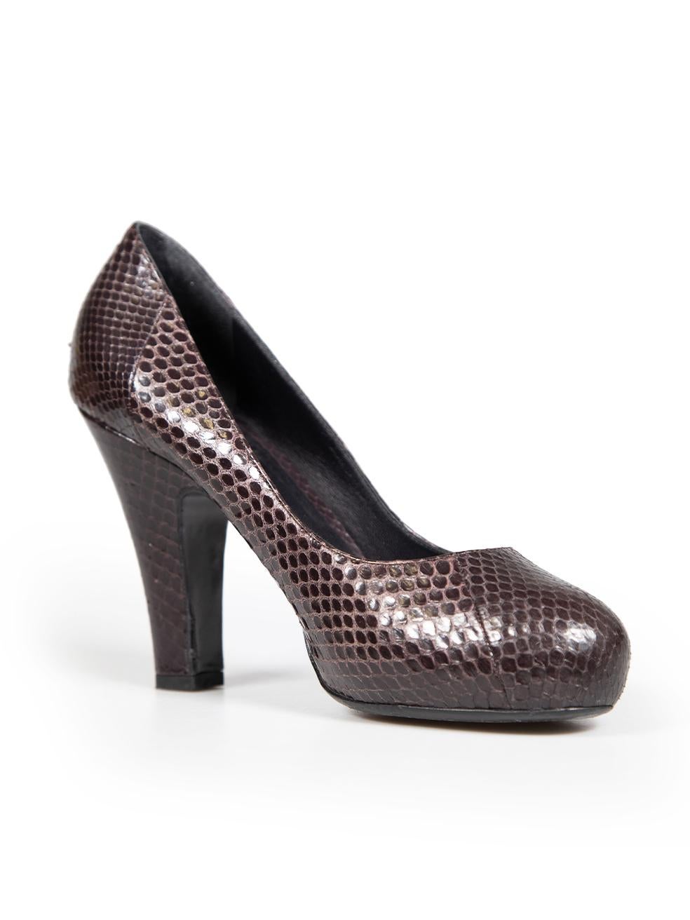 CONDITION is Very good. Minimal wear to the shoes is evident, there is mild discolouration on the rear of the left and right shoe on this used Bottega Veneta designer resale item.
 
 Details
 Purple
 Python
 Pumps
 Round toe
 High block heel
 
 
