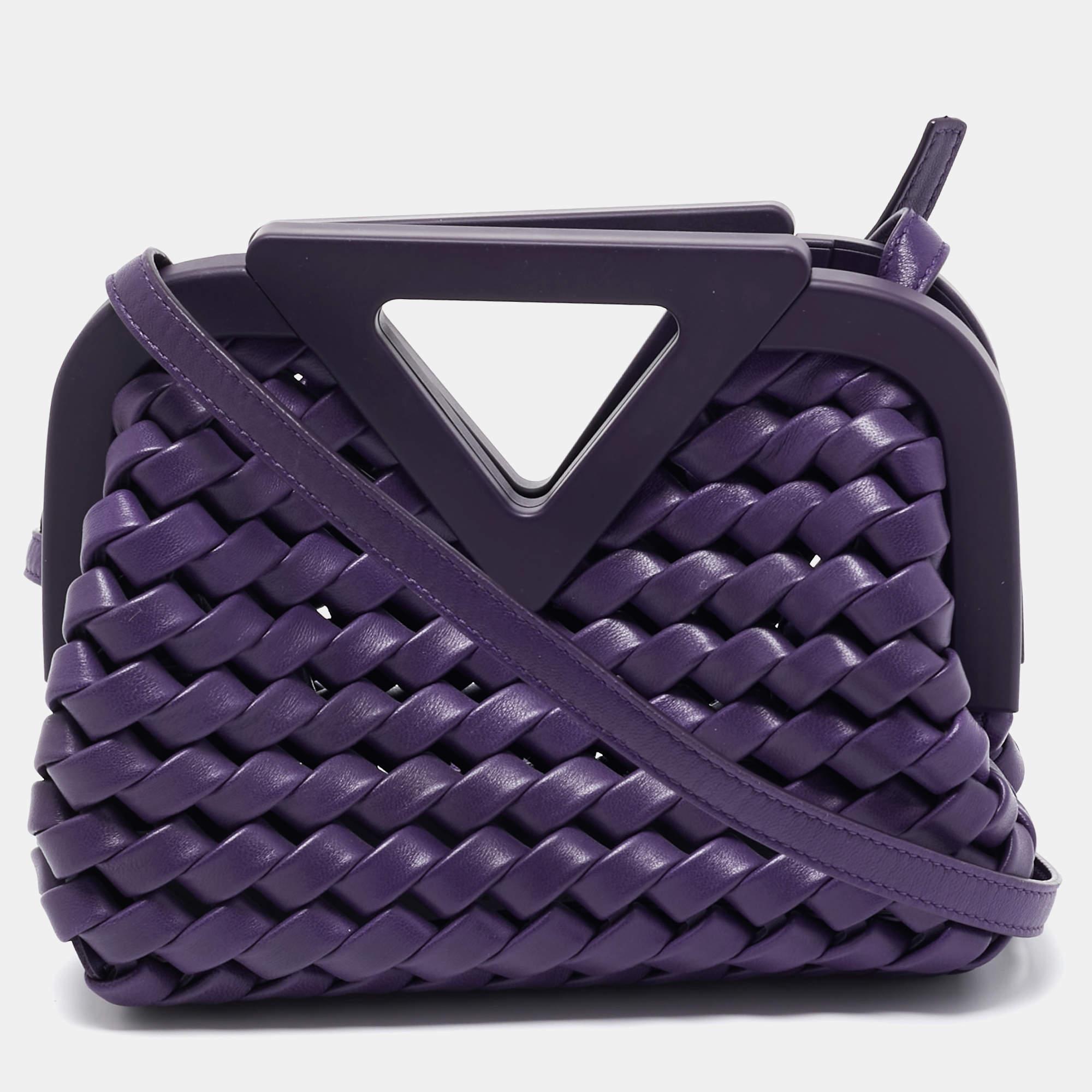 This Bottega Veneta Point shoulder bag presents an artistic weave design through the use of purple leather. It has a frame top, a lined interior, and an adjustable shoulder strap. Make it part of your modern wardrobe.

Includes: Original Dustbag,