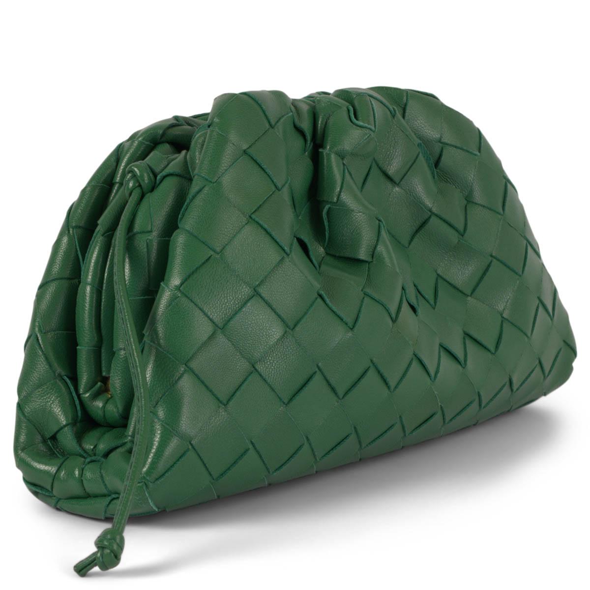 100% authentic Bottega Veneta Mini Pouch in Racing green Intrecciato leather. Opens with a magnetic frame closure and has a single compartment lined in calfskin. Has been carried and is in excellent condition. Comes with dust