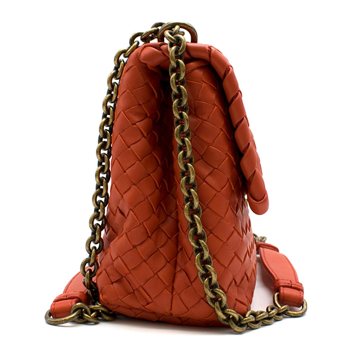 Bottega Veneta Red Small Intrecciato Olimpia Bag

-Red, lambskin
-Cross-woven pattern
-Shoulder bag 
-Brass hardware
-Flap and magnetic closure 
-Two interior main compartments
-Small zip compartment 
-Adjustable hand strap/shoulder strap
-Nude