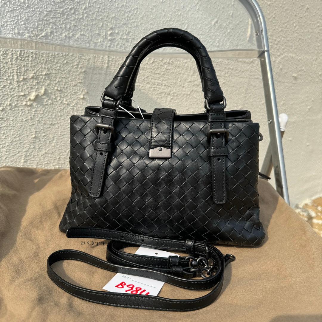 Bottega Veneta Roma Handbag Bag Intrecciato Nappa Leather Black Mini 25cm
 These are professional photos of the actual bag offered by Luxbags.
 This Bottega Veneta Roma Bag is an exceptional piece of luxury, crafted from iconic black leather with
