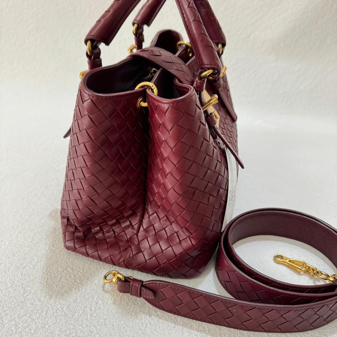 Bottega Veneta Roma Handbag Bag Intrecciato Nappa Leather Burgundy Small 30cm
 These are professional photos of the actual bag offered by Luxbags.
 This Bottega Veneta Roma Bag is an exceptional piece of luxury, crafted from high quality leather