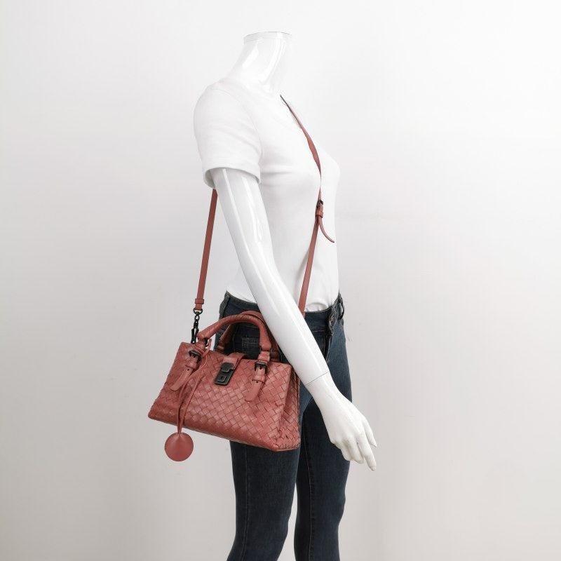 Bottega Veneta Roma Mini Bag Intrecciato Nappa Leather Pink 25cm
 These are professional photos of the actual bag.
 This Bottega Veneta Roma Bag is an exceptional piece of luxury, crafted from iconic black leather with the instantly recognizable