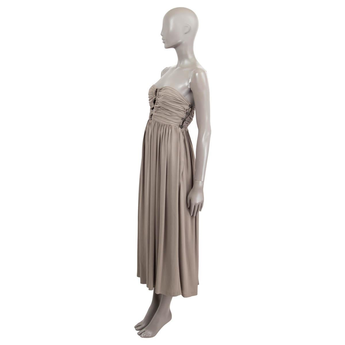 100% authentic Bottega Veneta sleeveless bustier midi dress in 100% sage silk. Opens with buttons on the left and features cut-outs on the front and back. Flared towards the back and draped details on the front of the bustier. Has been worn and is
