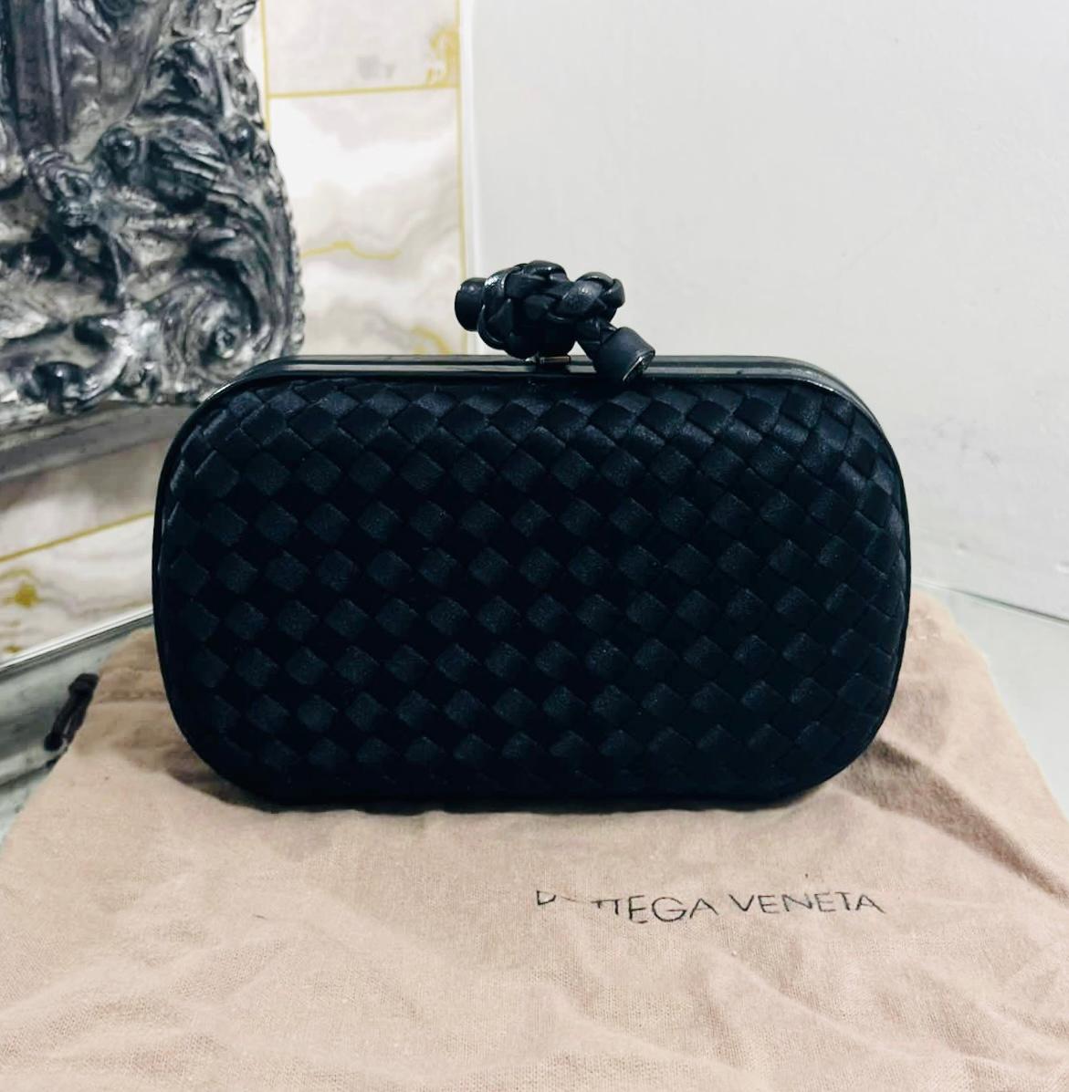 Bottega Veneta Silk Top Knot Clutch Bag

Black bag designed with the brand's signature Intrecciato weave.

Features black palladium knot twisted closure.

Size – Height 10cm, Width 17cm, Depth 5cm

Condition – Good (Signs of wear to the interior,