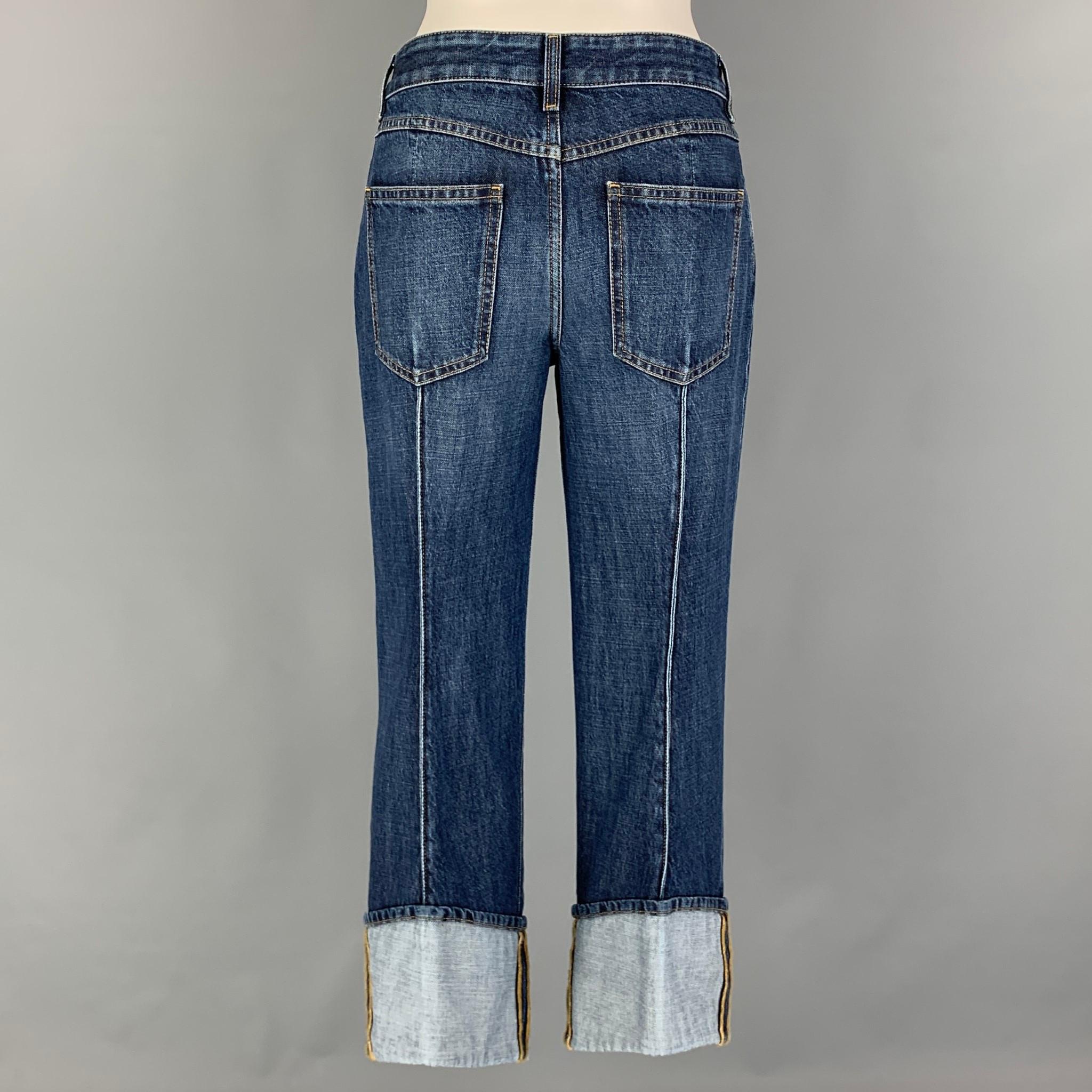 BOTTEGA VENETA jeans comes in a blue washed cotton featuring a cropped leg, pinched seam, cuffed leg, contrast stitching, and a button fly closure. Made in Italy.

Excellent Pre-Owned Condition.
Marked: 36
Original Retail Price: