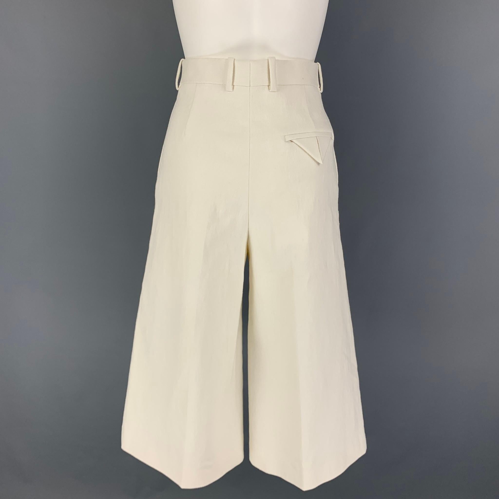 BOTTEGA VENETA pants comes in a cream wrinkled linen featuring a wide leg style, high waisted, front tab, and a zip fly closure. Made in Italy. 

Excellent Pre-Owned Condition.
Marked: 38
Original Retail Price: $1,135.00

Measurements:

Waist: 30