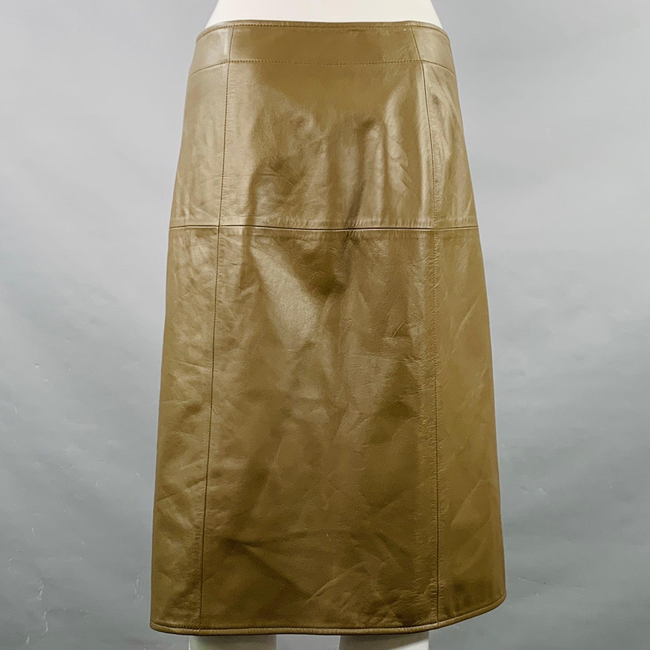 BOTTEGA VENETA skirt
in an olive green lambskin leather featuring a pencil style, and hidden button closure with thigh slit. Made in Italy.Excellent Pre-Owned Condition. 

Marked:   IT 38 

Measurements: 
  Waist: 29 inches Hip: 36 inches Length: 24