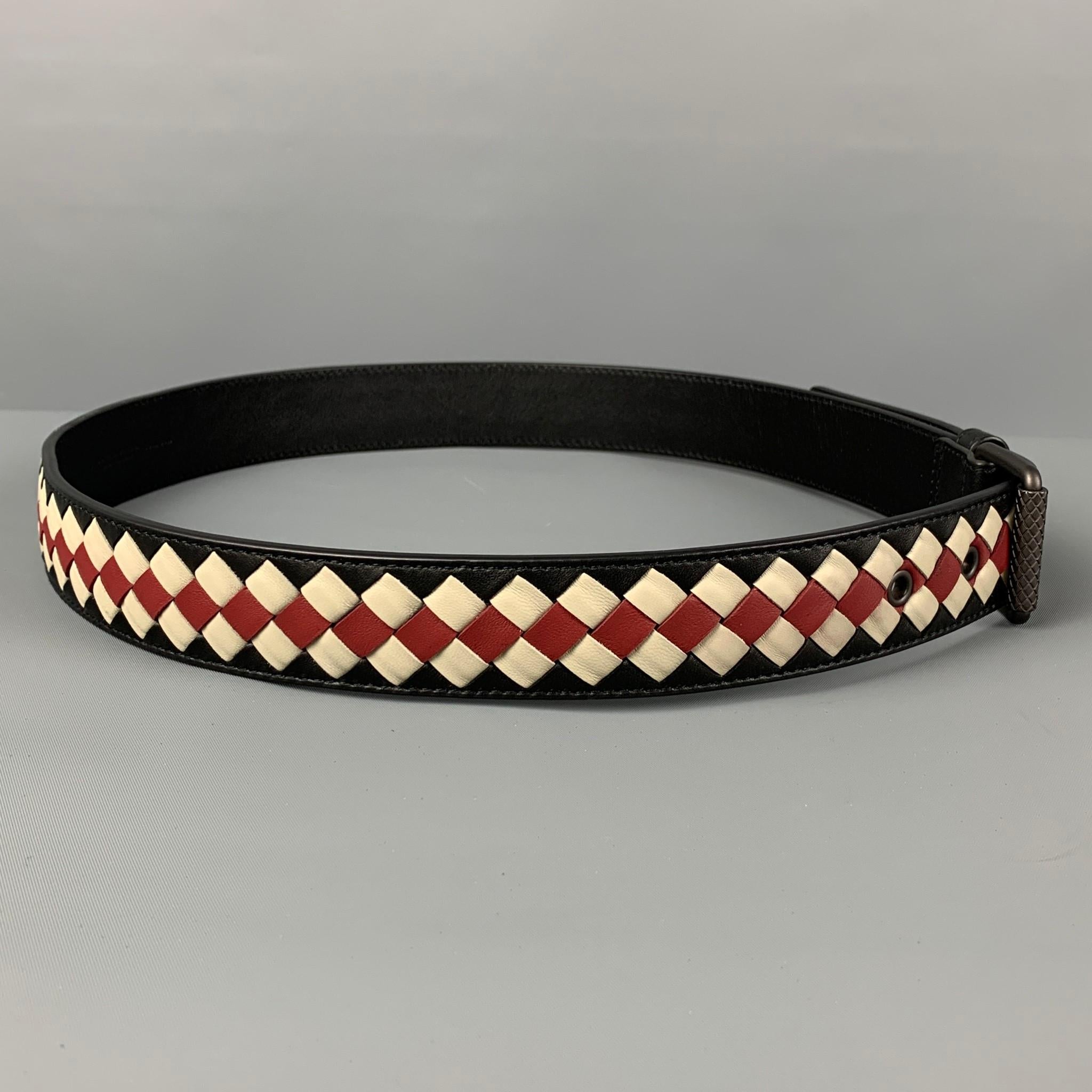 BOTTEGA VENETA belt comes in a black & red woven leather featuring a buckle closure. Made in Italy. 

Very Good Pre-Owned Condition. Minor wear.
Marked: 85/34
Original Retail Price: $790.00

Length: 38.5 in.
Width: 1.25 in.
Fits: 30 in. - 35
