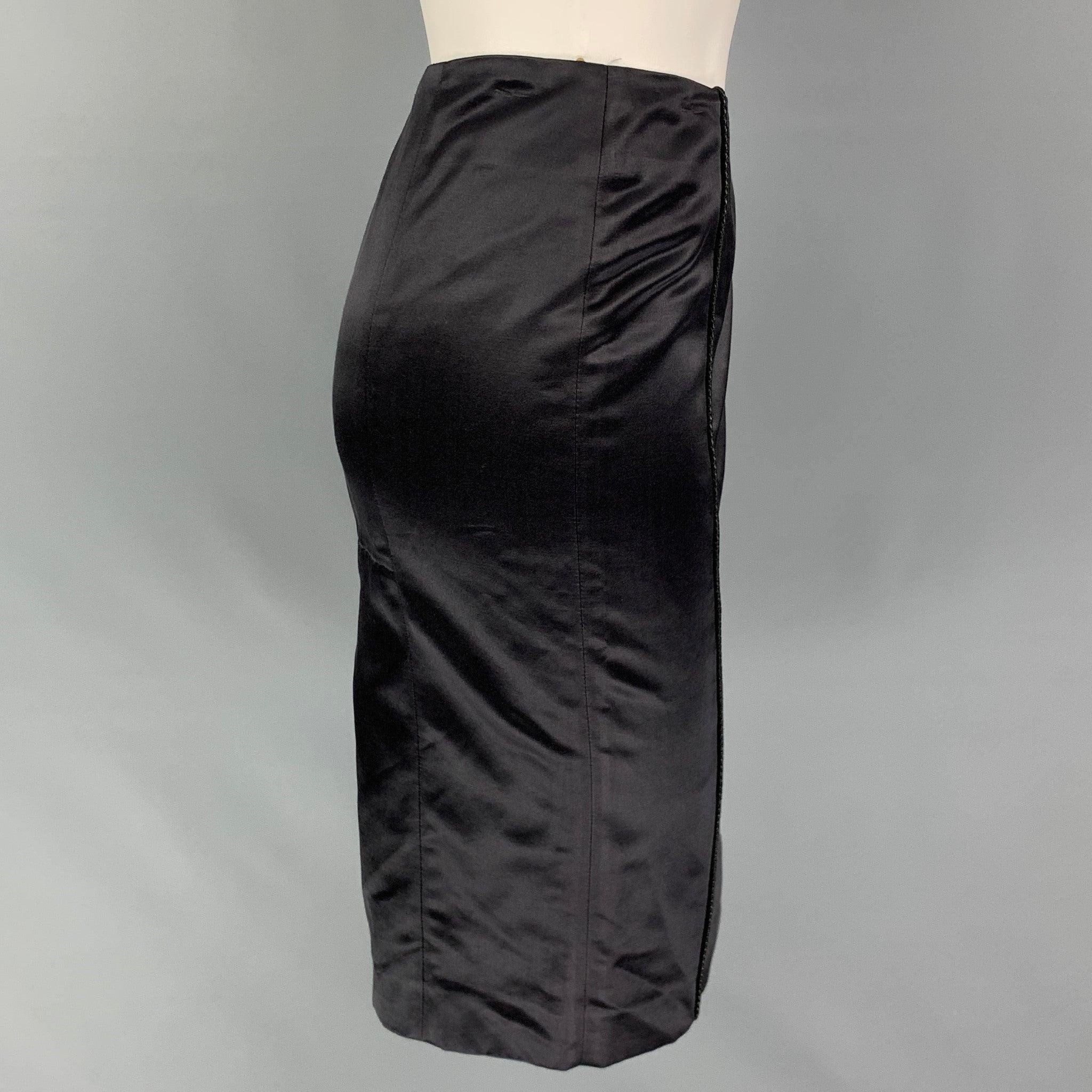 BOTTEGA VENETA skirt comes in a black cotton / silk featuring a pencil style, leather woven detail, and a back zipper closure. Made in Italy.
Very Good
Pre-Owned Condition. 

Marked:   40 

Measurements: 
  Waist: 26 inches  Hip:
32 inches  Length: