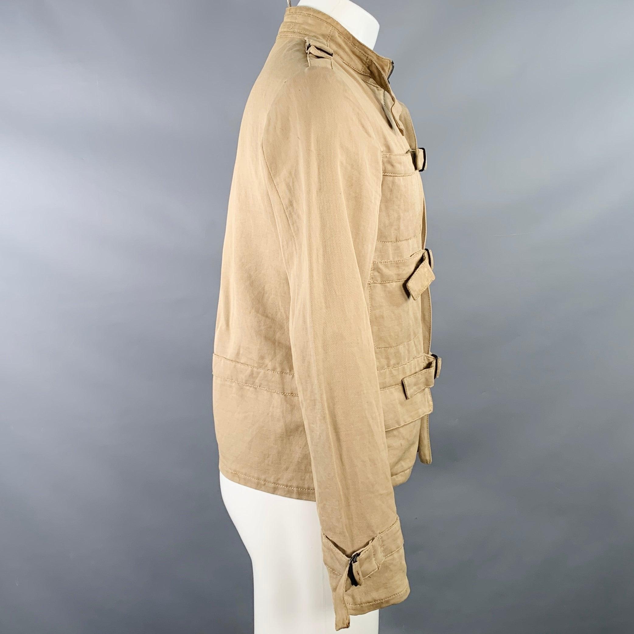 BOTTEGA VENETA jacket
in a
khaki linen cotton woven blend twill featuring multiple utilitarian pockets (four slip, two flap) and hidden zip up closure with bondage-style buckles. Made in Italy.Good Pre-Owned Condition. Moderate marks, please check