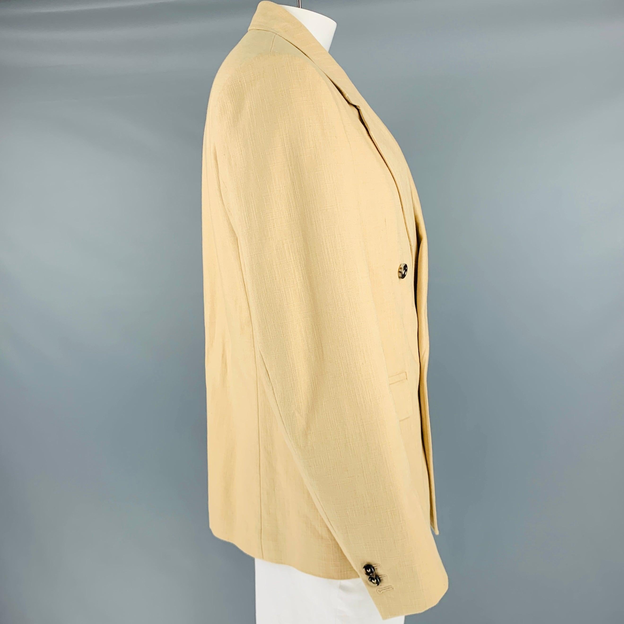BOTTEGA VENETA spot coat
in a heavyweight khaki woven cotton featuring a double-breasted style, notch lapel, and single button closure. Made in Italy.Very Good Pre-Owned Condition with Tags. Miniscule mark on collar. 

Marked:   52 

Measurements: 

