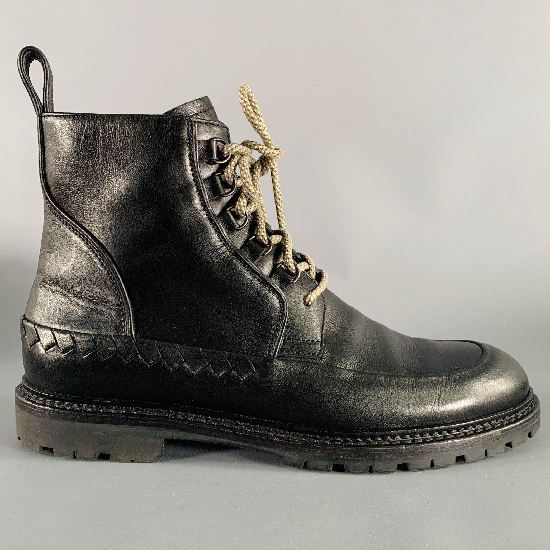 BOTTEGA VENETA boots
in a black leather featuring signature woven details, rubber sole, and lace-up closure. Comes with dust bag. Made in Italy.Very Good Pre-Owned Condition. 

Marked:   IT 41.5 

Measurements: 
  Length: 11.5 inches Width: 4 inches