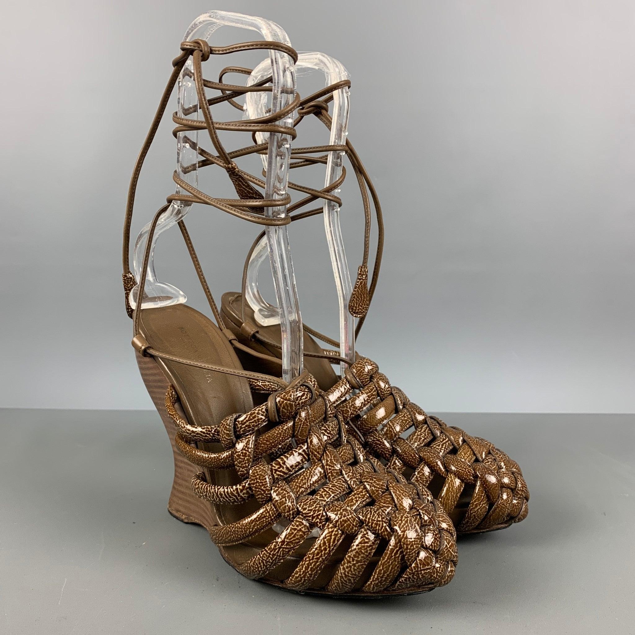 BOTTEGA VENETA wedge sandals comes in a brown and olive patent leather featuring a pointed toe, and an ankle strap. Very Good Pre-Owned Conditions. 

Marked:   38 1/2 

Measurements: 
  Heel: 5 inches Platform: 0.75 inches  
  
  
 
Reference: