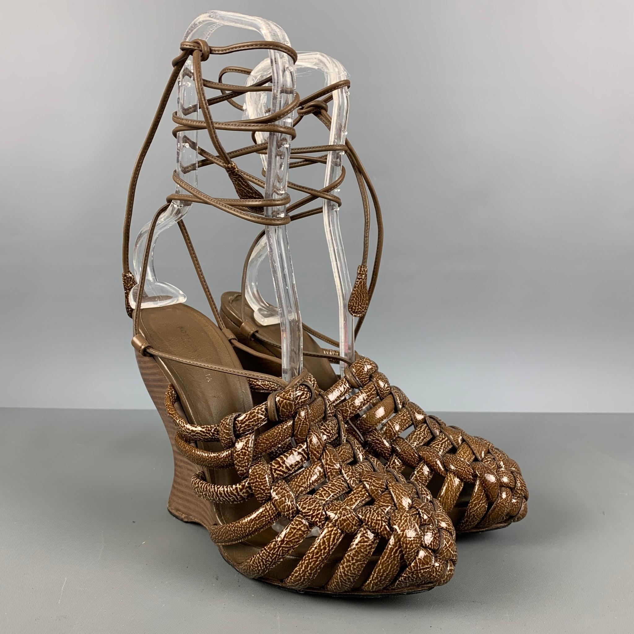 BOTTEGA VENETA wedge sandals comes in a brown and olive patent leather featuring a pointed toe, and an ankle strap.

Very Good Pre-Owned Conditions.
Marked: 38 1/2

Measurements:

Heel: 5 in.
Platform: 0.75 in.  

SKU: 124570
Category: Sandals

More