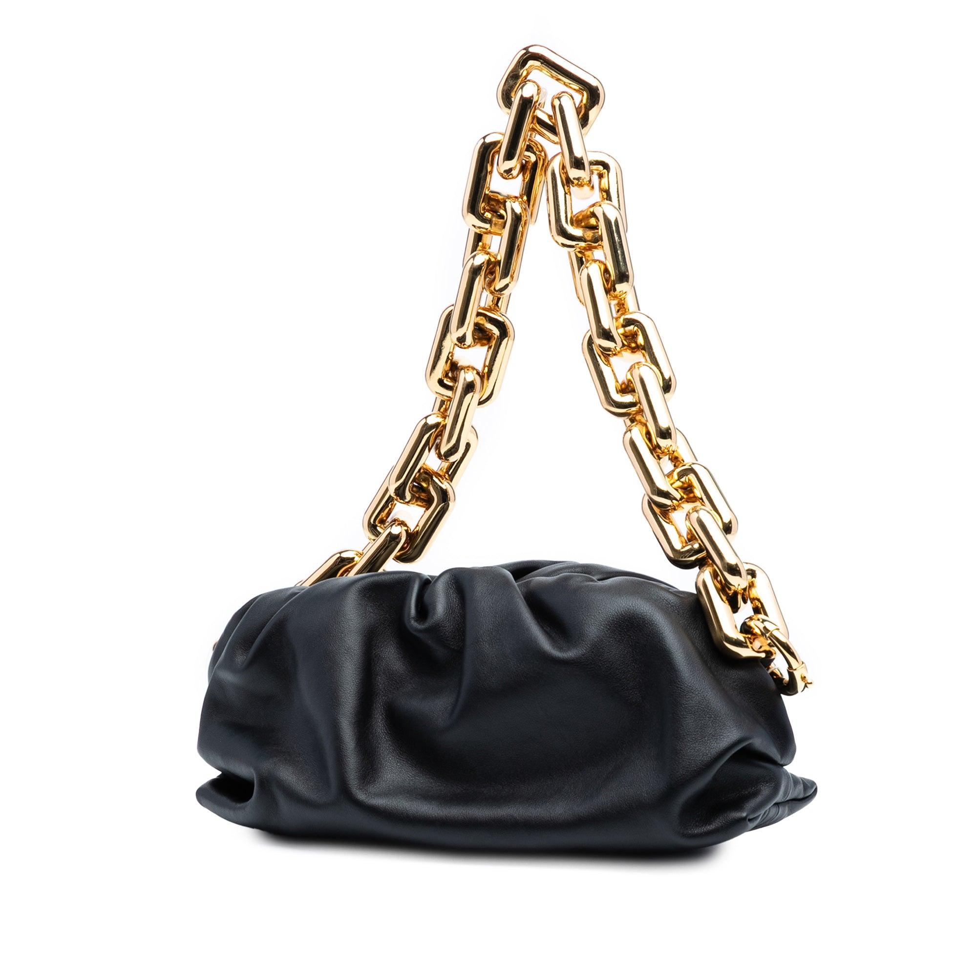 The Chain Pouch features a leather body, a gold-tone chain link strap, and a top magnetic frame closure.

Scratches. Exterior Back Feature(s) Minor Stains. Interior Lining Feature(s) Minor Stains. Exterior Bottom Feature(s) Minor Stains. Front