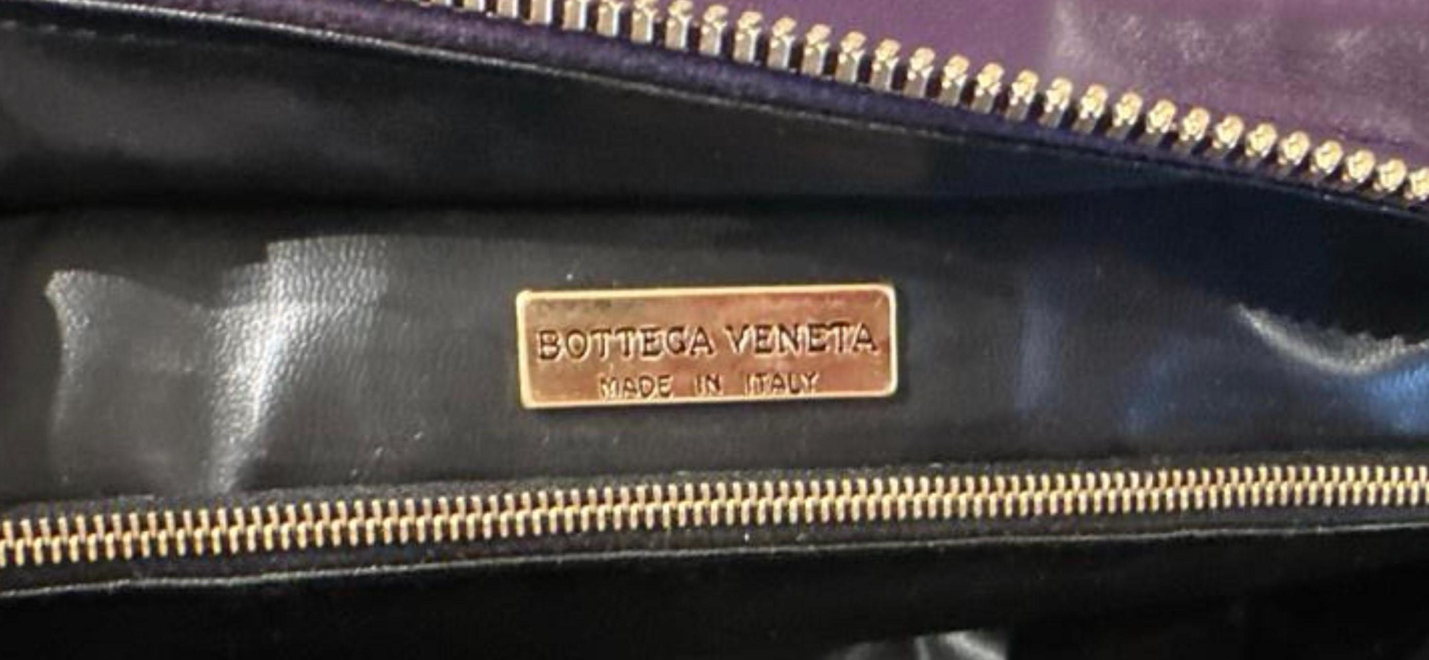 Black Bottega Veneta Small Purple Strap with front pocket. 