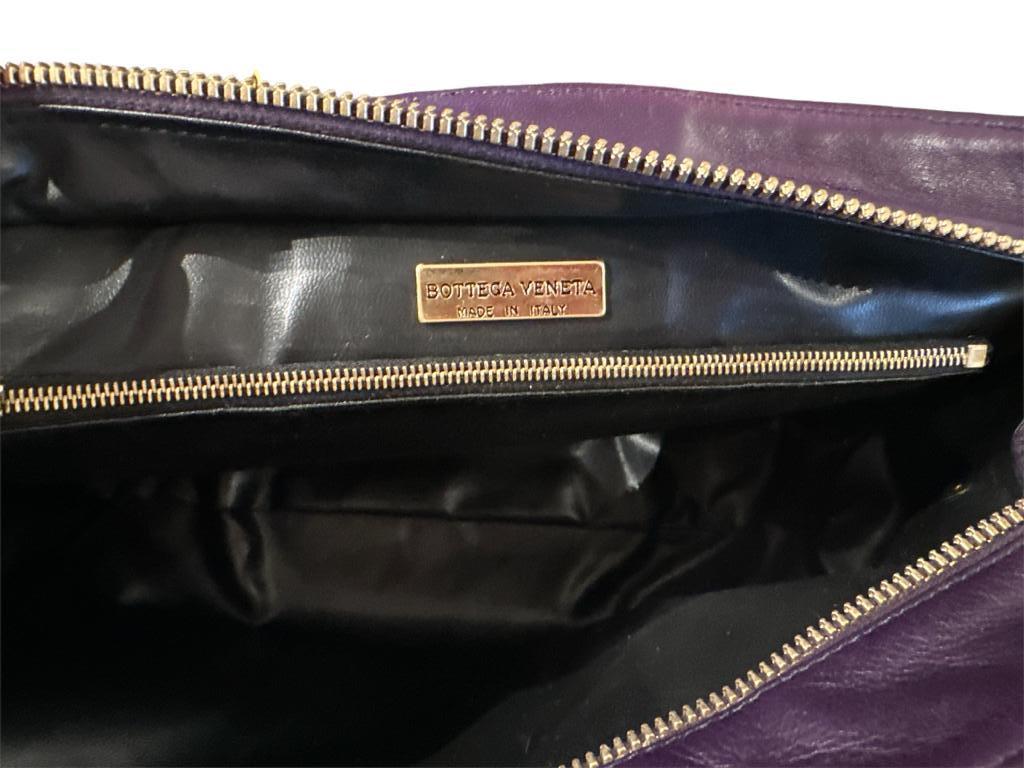 Bottega Veneta Small Purple Strap with front pocket. Great condition very gently used clean inside. 
Small mark on top near outside zipper. Bottega is best known for its signature woven leather design, this bag is perfect for all occasions.
