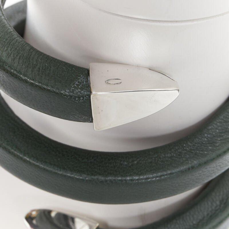 BOTTEGA VENETA  Spiral Coil forest green leather cuff bracelet
Reference: LNKO/A01912
Brand: Bottega Veneta
Designer: Daniel Lee
Model: Spiral Coil
Material: Leather
Color: Green, Silver
Pattern: Solid
Extra Details: Dark green leather bangle.