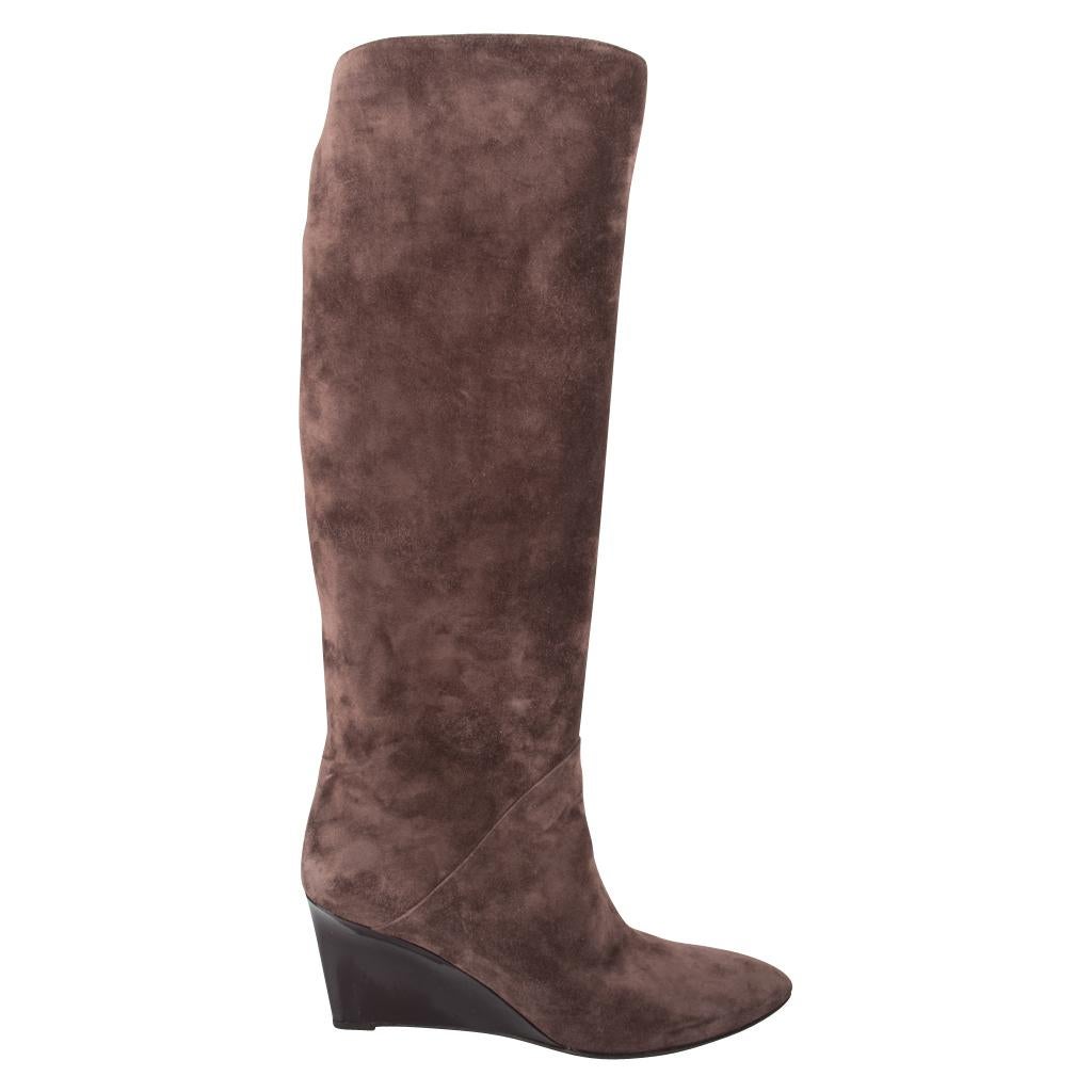Guaranteed authentic Bottega Veneta chic knee high wedge boots.
Unique dark mushroom taupe colour lush soft is utterly neutral - fabulous with black.
Patent leather wedge is shaped and sleek. 
Pull on boot.
**GENTLY POINTED TOE WOULD LEND TO A 8.5