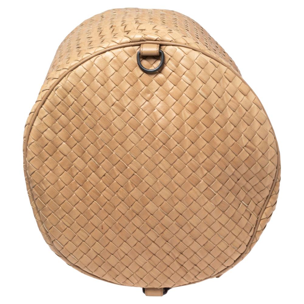 Crafted from leather using their famous Intrecciato technique, this sling backpack from Bottega Veneta features a drawstring design. The tan bag has an adjustable shoulder strap and a well-sized interior to hold your essentials.

Includes: Original