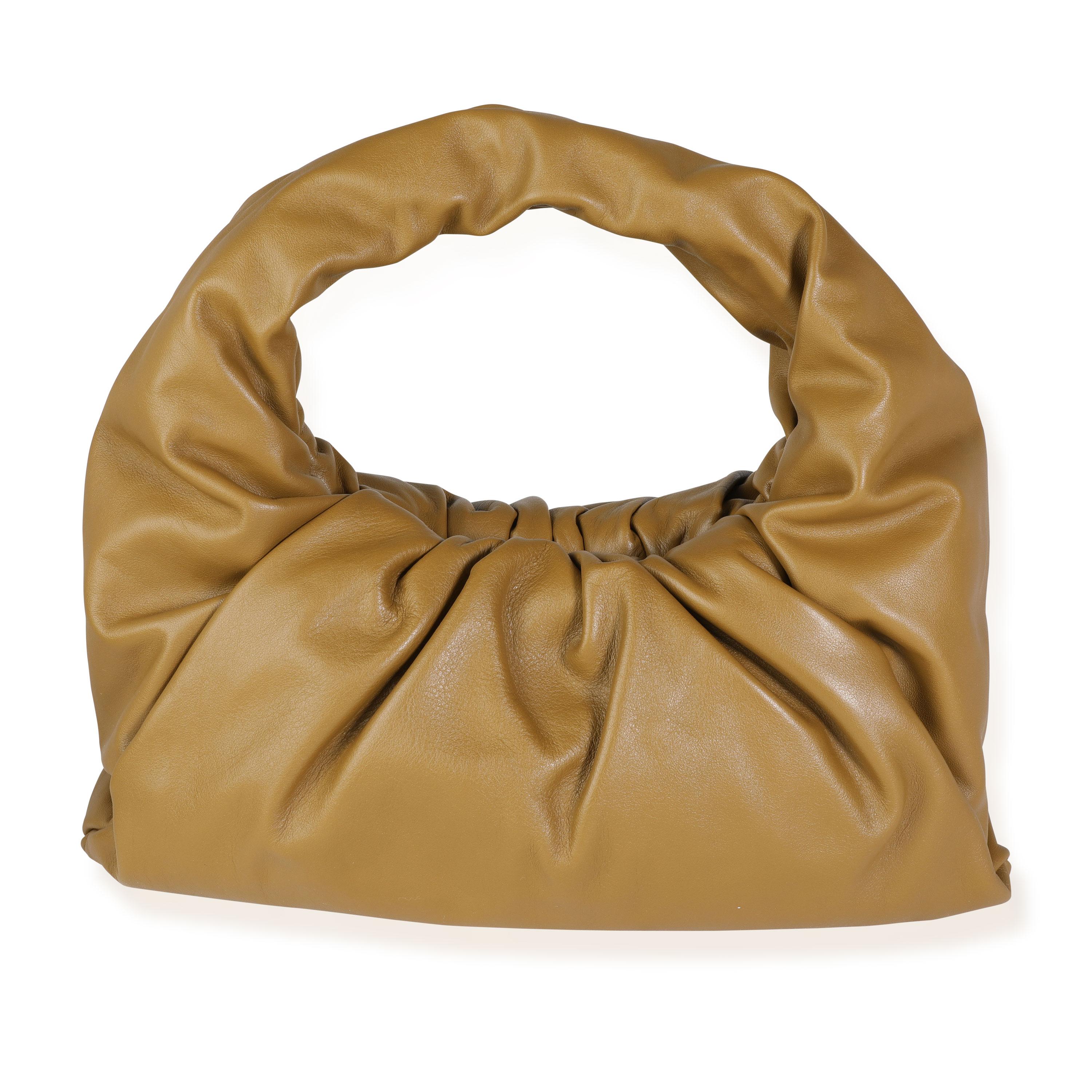 Listing Title: Bottega Veneta Teak Calfskin Leather Shoulder Pouch Bag
SKU: 115931
MSRP: 2800.00
Condition: Pre-owned (3000)
Condition Description: The Bottega Veneta Calfskin Leather Shoulder Pouch Bag, here in Teak Brown, is the perfect bag for