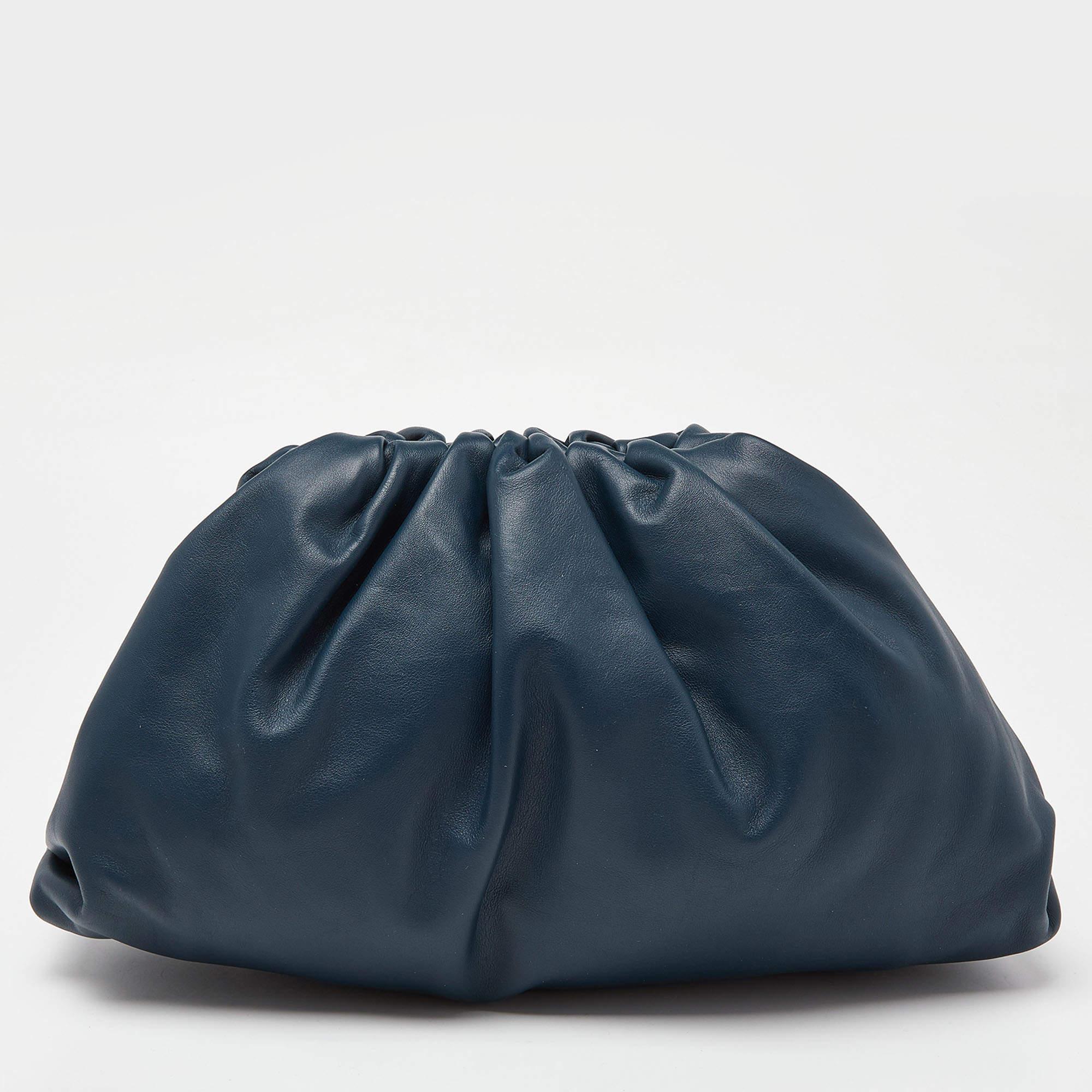 This Bottega Veneta The Pouch clutch is a creation marked by excellent craftsmanship and refined style. It is crafted with skill and impeccably finished to be a luxurious accessory in your hand.

Includes: Original Dustbag, Info Booklet

