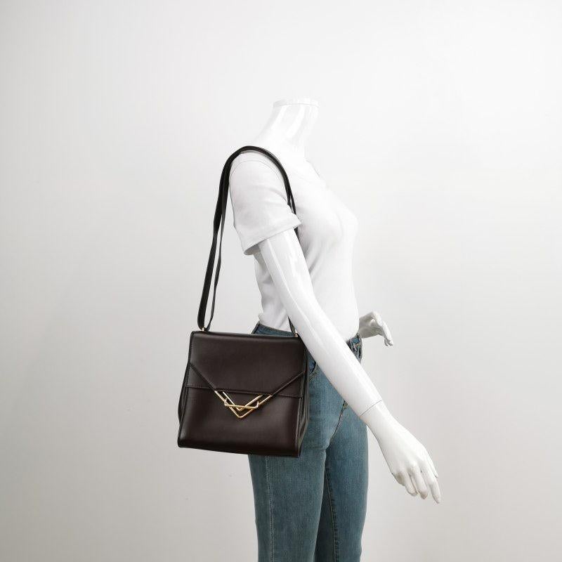 Bottega Veneta The Clip Burgundy Crossbody Bag
 These are professional photos of the actual bag offered by Luxbags.
 CONDITION: VERY GOOD
 Light scratches and stains on the leather. Light scratches to the hardware. Light rubbing on the corners. 
