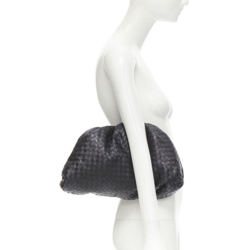 BOTTEGA VENETA The Intrecciato Pouch black signature woven leather clutch bag
Reference: KEDG/A00115
Brand: Bottega Veneta
Designer: Daniel Lee
Model: The Pouch
Material: Leather
Color: Black
Pattern: Solid
Closure: Magnet
Lining:  Leather
Extra