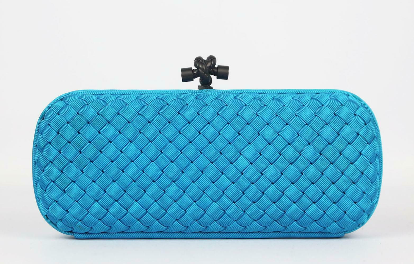 Bottega Veneta's 'Knot' clutch is such an enduring style, this version is woven from strips of lustrous faille silk using the label's signature intrecciato technique and beautifully finished with the brand's signature gunmetal knot. 
Blue