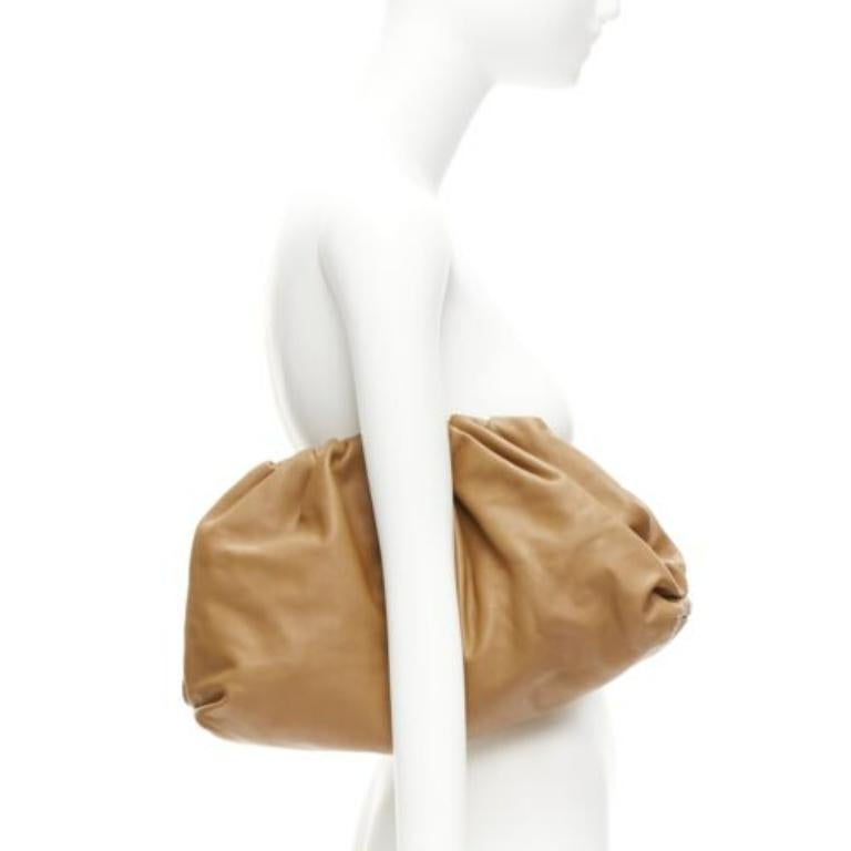 BOTTEGA VENETA The Pouch brown leather dumpling clutch bag
Reference: TGAS/D00841
Brand: Bottega Veneta
Designer: Daniel Lee
Model: The Pouch
Material: Leather
Color: Brown
Pattern: Solid
Closure: Magnet
Lining: Brown Leather
Extra Details: This