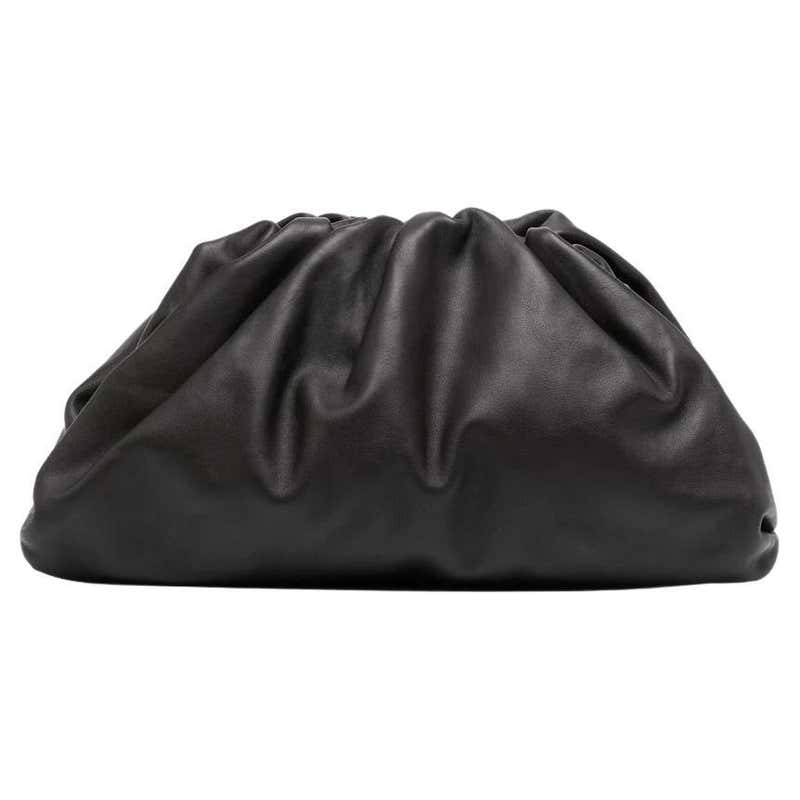 The Bottega Veneta Pouch: Frameless Volumetric Slouch and the Architecture of Minimalist Enclosure