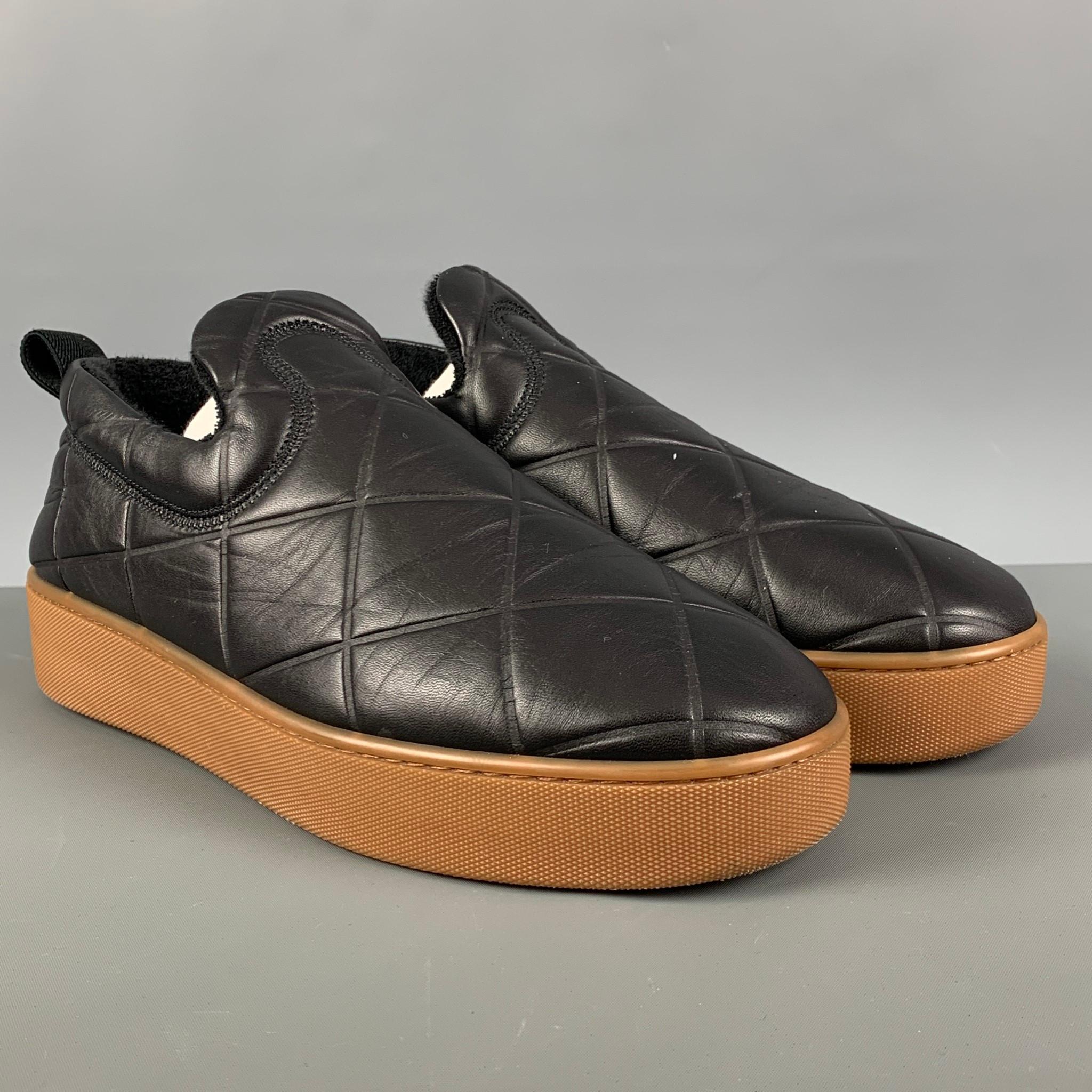 BOTTEGA VENETA 'The QUILT' loafers comes in a black lamb skin leather featuring a low-top, quilted pattern, tonal terry cloth lining, textured rubber midsole in tan and threaded rubber outsole in tan. Made in Italy. Comes with Dusty Bag.

Excellent