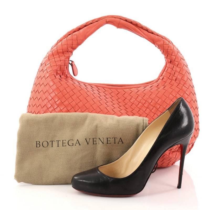 This authentic Bottega Veneta Veneta Hobo Intrecciato Nappa Small is a timelessly elegant bag with a casual silhouette. Excellently crafted from pink nappa leather woven in Bottega Veneta's signature intrecciato method, this no-fuss hobo features a