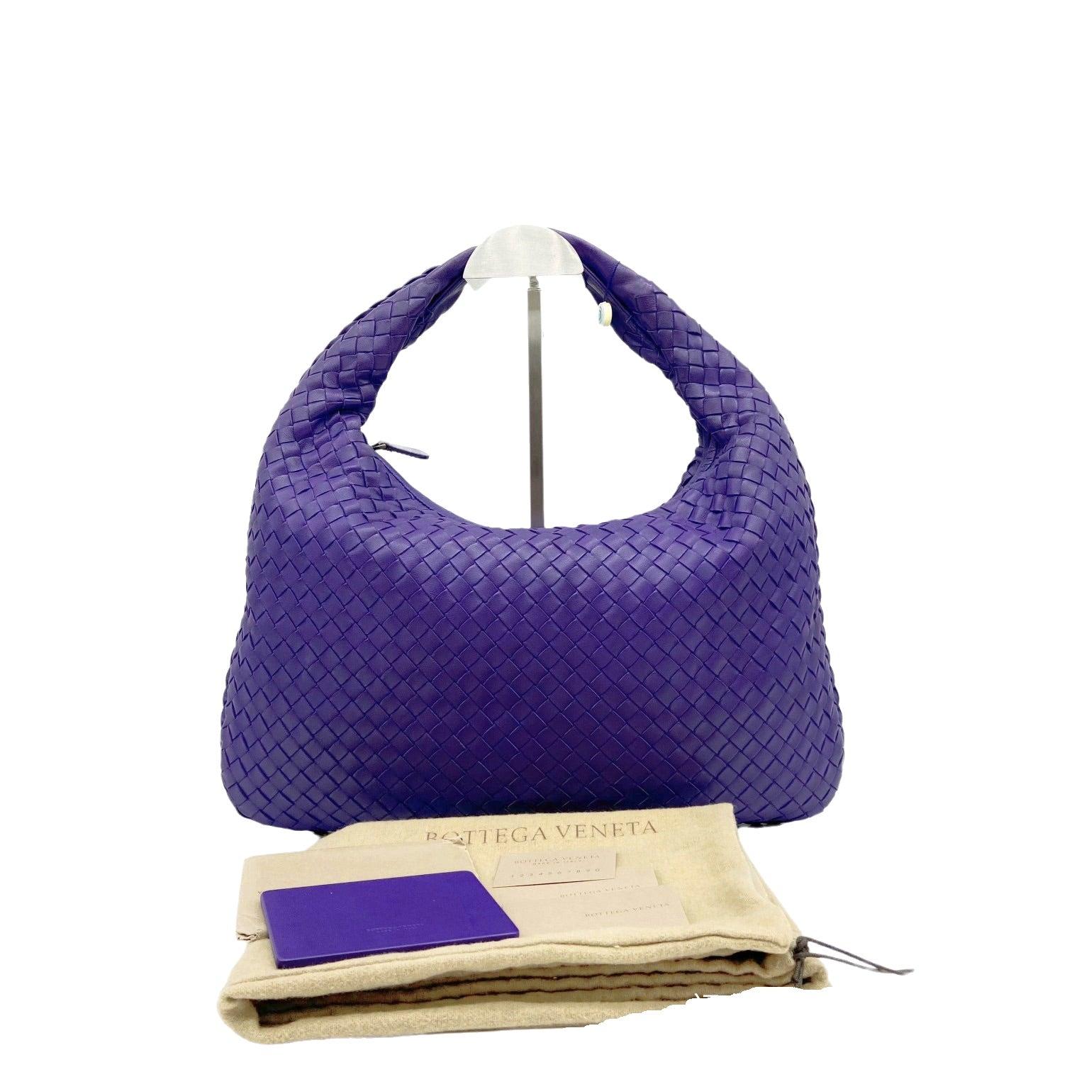 Bottega Veneta Veneta Hobo Medium Purple Intrecciato Leather Bag These are professional photos of the actual bag offered by Luxbags. This Bottega Veneta Veneta Bag is an exceptional piece of luxury, crafted from iconic lambskin leather with the