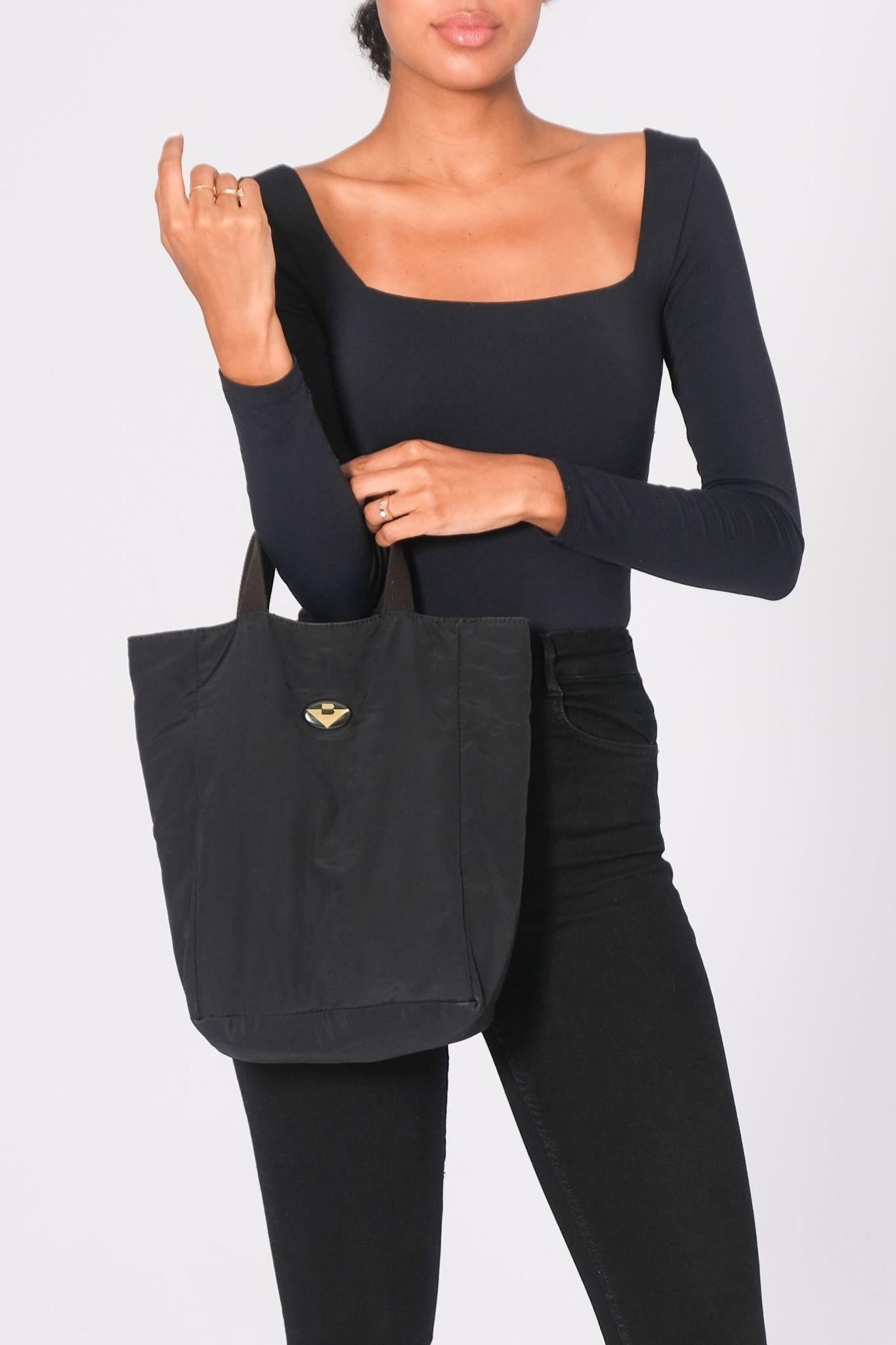 Unique Bottega Veneta vintage bag form the 1990s. Designer is Laura Braggion.

Color: Black
Material: synthetic
Style No. 10734707053NE
4673 8G618 97128
Comes with: generic dust bag
Condition: Good. Light signs of use, creases & marks.