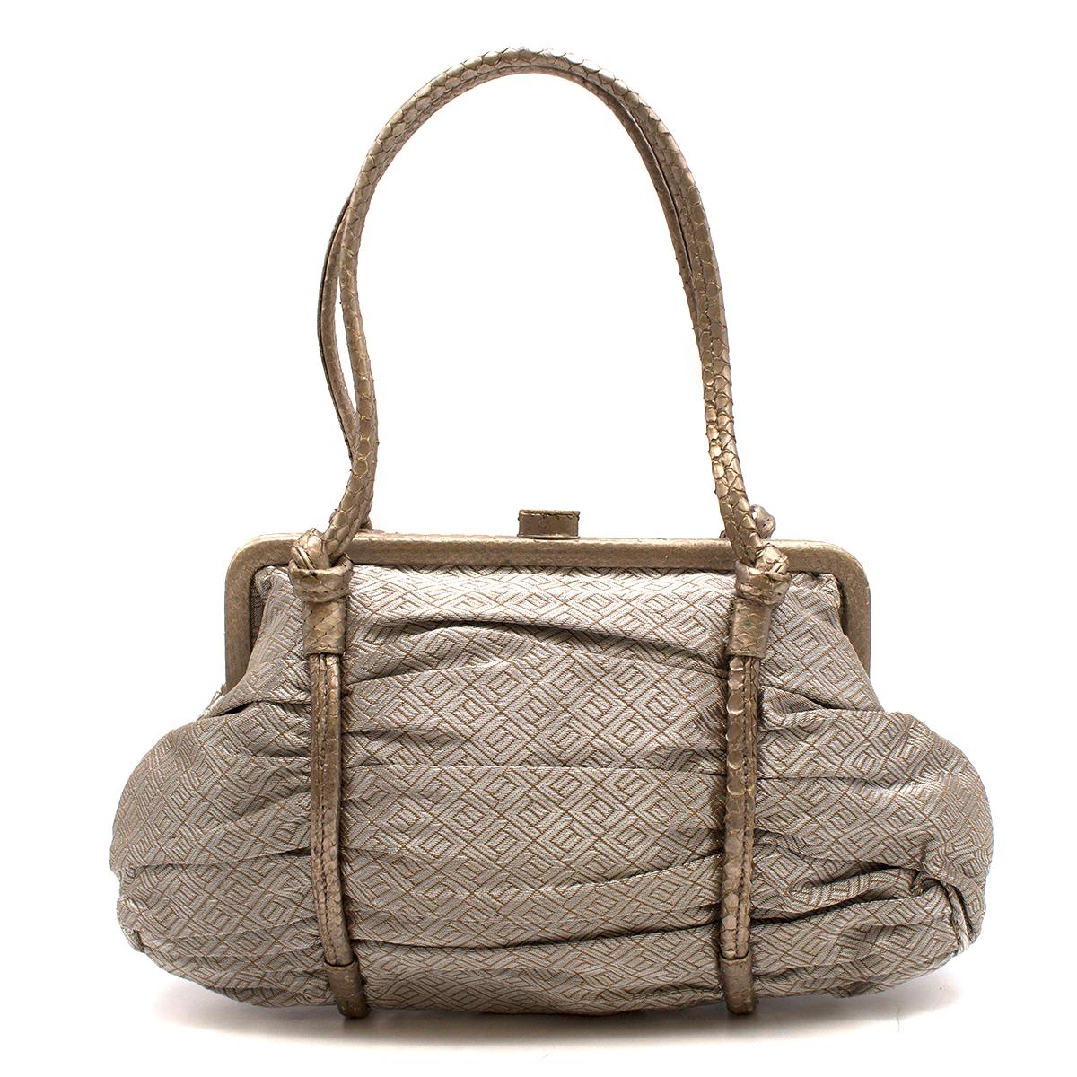 Bottega Veneta Vintage Metallic Top Handle Bag

- Cloth tote bag 
- Push clasp fastening
- Top carry handle in python leather pattern
- Matching colour frame 
- Leather hardware
- Internal push button pocket


Please note, these items are pre-owned