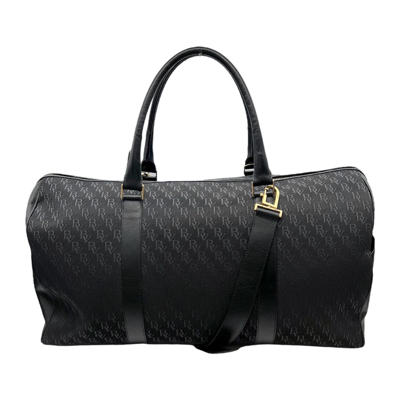 We are offering this black Bottega Veneta Monogram Duffle Bag. Made in Italy, it is finely crafted of a black Bottega Veneta Monogram canvas exterior with black leather trimming and gold-tone hardware features. It also has 2 slip pockets on the side