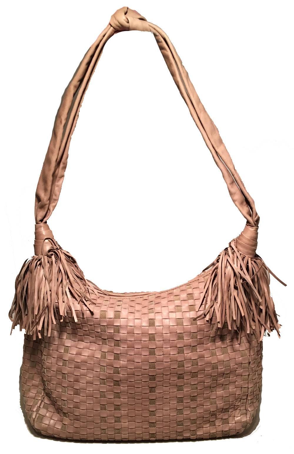 rare Bottega Veneta Vintage Tan Woven Leather Fringe Trim Shoulder Bag in excellent condition.  Tan signature woven leather exterior trimmed with a soft leather shoulder strap with knot at shoulder and tan leather fringe at both ends of strap.  Top