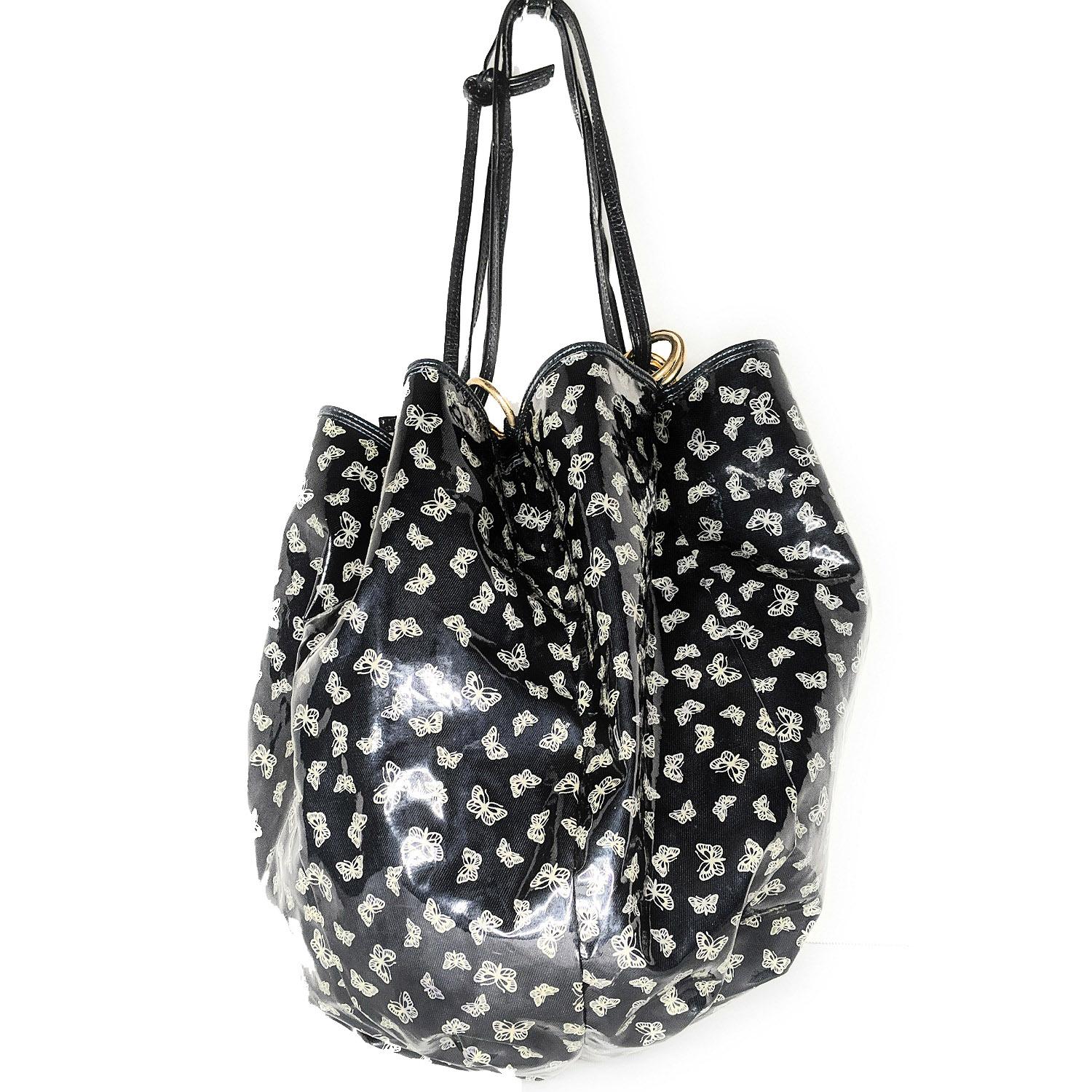 Casual meets dressy; this stylish butterfly-print bucket bag is beautifully crafted of vinyl coated exterior with golden brass hardware. The bag features a drawstring closure. A roomy interior lined in vinyl. Made in Italy.

Designer: Bottega