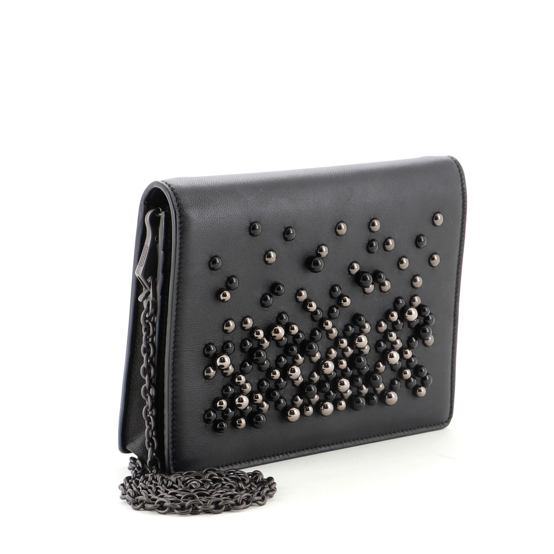 Bottega Veneta Wallet on Chain Pearl Embellished Leather
Black

Condition Details: Light scuffs and wear on exterior and underneath flap, scratches on hardware.

50005MSC

Height 